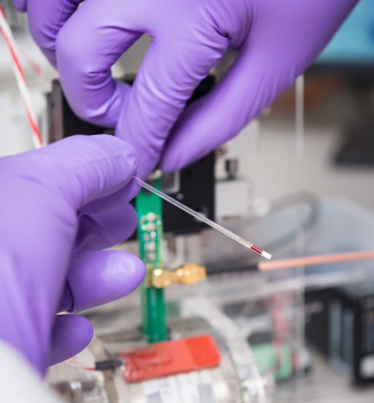 small drop of blood being inserted into device