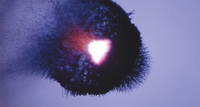 image of laser hitting ink drop