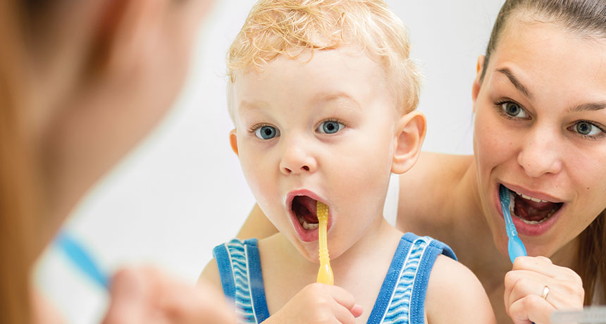 child brushing teeth