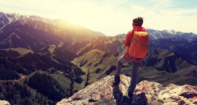 hiker taking in view of mountains