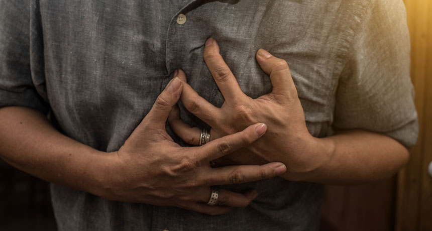 person grasping their chest