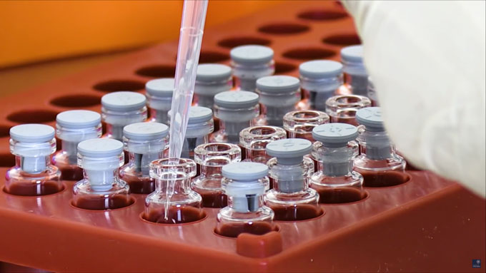 tray of vials of vaccine