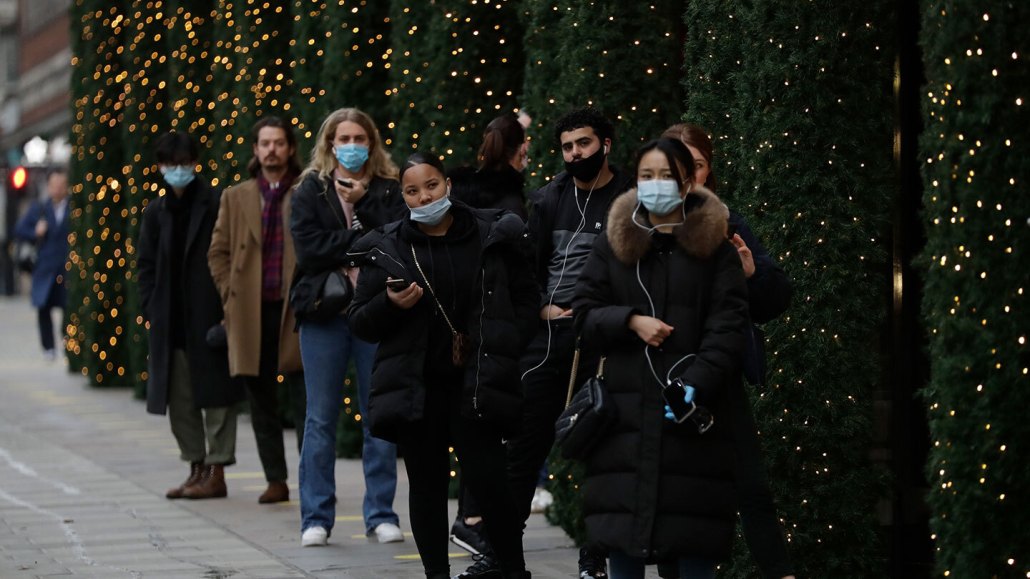line of shoppers outside Selfridges department store