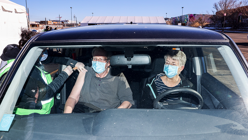 Jack Cook recieving his covid-19 vaccine shot in his car