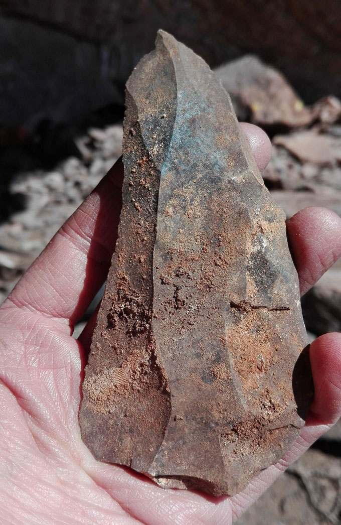 hand holding stone tool