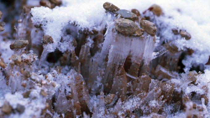 columns of ice mixed in with pebbles and dirt