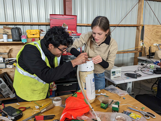 Researchers pack a drop capsule for a NASA balloon telescope