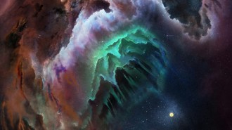 A cloud in space with wisps of green, blue, purple and reddish gas swirling around a dark, jagged core, set against a star-filled background with a glowing yellow star at the lower right.