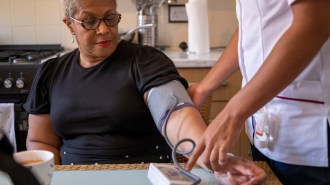 A woman getting her blood pressure taken.