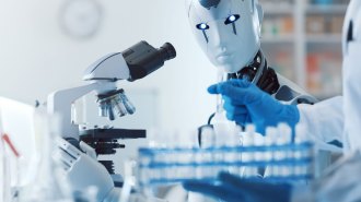 This concept image shows a robot figure representing AI at a microscope while blue-gloved hands of a human scientist hold vials.